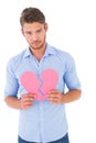 Sad man holding a broken heart Royalty Free Stock Photo