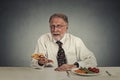 Sad man looking at pizza tired of salad diet Royalty Free Stock Photo