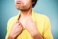 Sad man pulling his shirt Royalty Free Stock Photo