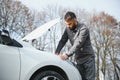 Sad man on the road next to the broken car Royalty Free Stock Photo