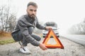 Sad man on the road next to the broken car Royalty Free Stock Photo