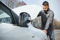 Sad man on the road next to the broken car Royalty Free Stock Photo