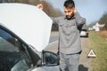 Sad man on the road next to the broken car Royalty Free Stock Photo