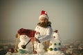 Sad man in santa hat ladling soup on winter day Royalty Free Stock Photo