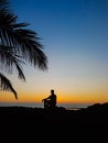 Sad Man Sitting On The Rock In The Beach Royalty Free Stock Photo