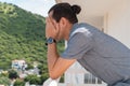 Sad man standing on the balcony. He is worried, depressed, thoughtful and lonely Royalty Free Stock Photo