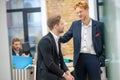 Sad man and supportive colleague with red hair Royalty Free Stock Photo