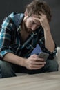 Really sad man using phone Royalty Free Stock Photo