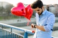 Sad man waiting for date on valentine date Royalty Free Stock Photo