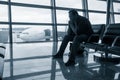 Sad man waiting for delayed flight Royalty Free Stock Photo