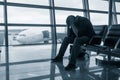 Sad man waiting for delayed flight Royalty Free Stock Photo