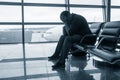 Sad man waiting for delayed flight Royalty Free Stock Photo