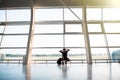 Sad young man waiting for delayed flight in airport Royalty Free Stock Photo