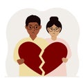 A sad man and woman are holding pieces of a broken red heart in their hands. Broken heart. Royalty Free Stock Photo