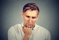 Sad man with worried stressed face expression looking down Royalty Free Stock Photo