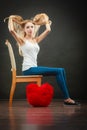 Sad melancholy woman with red heart pillow Royalty Free Stock Photo