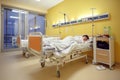 Sad middle-aged woman lying in hospital