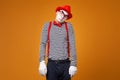Sad mime in vest and red hat Isolated Royalty Free Stock Photo