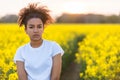 Sad Mixed Race African American Teenager Woman in Yellow Flowers Royalty Free Stock Photo