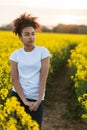 Sad Mixed Race African American Teenager Woman in Yellow Flowers Royalty Free Stock Photo