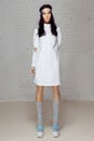 Sad model in white dress in studio Royalty Free Stock Photo