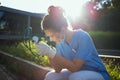 Sad modern physician woman sitting outside near clinic