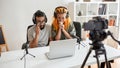 Sad movie. Couple of bloggers, young man and woman looking sad, crying while watching something on laptop, recording Royalty Free Stock Photo