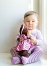 Sad nice baby girl with toy bear Royalty Free Stock Photo