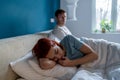 Offended unhappy woman after quarrel with boyfriend in bedroom. Difficult relations family conflict. Royalty Free Stock Photo