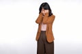 Sad office girl, asian woman sulking and frowning disappointed, standing upset and distressed against white background