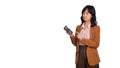 Sad office girl, asian woman sulking and frowning disappointed while using a calculator, standing upset and distressed against Royalty Free Stock Photo