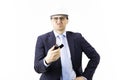 Sad oil engineer holding burning lighter in hand and looks at camera with frigh Royalty Free Stock Photo