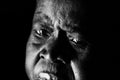 A sad old African woman looks on in despair Royalty Free Stock Photo