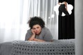 Sad overweight woman dreaming about slim body