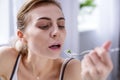 Sad pale woman holding a fork