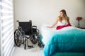 Sad paralyzed woman in bed Royalty Free Stock Photo