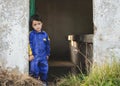 Sad and pensive child next to a door Royalty Free Stock Photo