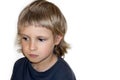 Sad and pensive little boy, portret, white copy space background. Royalty Free Stock Photo