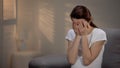 Sad pregnant woman crying, suffering prenatal depression, single motherhood