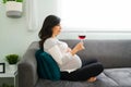 Sad pregnant woman thinking about drinking alcohol