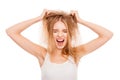 Sad pretty girl holding her damaged hair and shouting Royalty Free Stock Photo