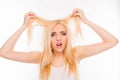 Sad pretty girl showing her damaged hair Royalty Free Stock Photo