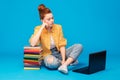 Sad red haired teenage student girl with laptop Royalty Free Stock Photo