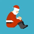 Sad Santa sitting isolated. Christmas dull grandfather. New Year Royalty Free Stock Photo