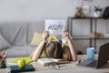 Sad school girl sleeping and holding paper asking for help Royalty Free Stock Photo