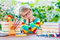 Sad school kid boy with glasses and student stuff Royalty Free Stock Photo