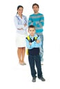 Sad schoolboy in front of parents Royalty Free Stock Photo