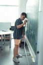 Sad schoolboy trying to cope with maths. Royalty Free Stock Photo