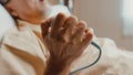 Sad senior Asia man having having heart attack lying on hospital bed and press emergency button. Sick aged guy lying hospitalized Royalty Free Stock Photo