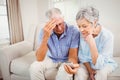 Sad senior couple looking at mobile phone Royalty Free Stock Photo